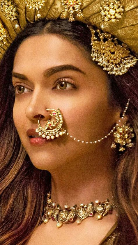 Love this mastani look | Credits: Bajirao Mastani (2015); jewellery by - Shri Hari Diagems | simple chain attached to spectacular nose ring design paired with simple necklace and matching jhoomar set |  | Indian Wedding Ideas | Nose Rings | Indian Accessories | Bridal Look | More bridal look ideas curated on  www.wittyvows.com shares things no one tells brides, covers real weddings, ideas, inspirations, design trends and the right vendors, candid photographers etc. Mastani Deepika Padukone, Bajirao Mastani, Dipika Padukone, Bridal Nose Ring, Indian Accessories, Deepika Padukone Style, Indian Nose Ring, Indian Woman, Nose Jewelry