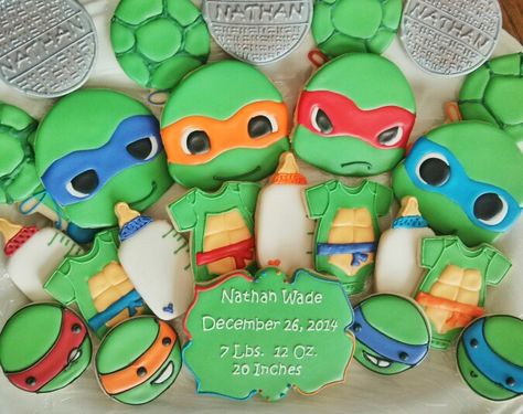 Baby Ninja Turtle cookies by A Fancy Cookie Ninja Turtles Baby Shower Ideas, Ninja Turtle Baby Shower Ideas, Turtle Baby Shower Cake, Turtle Baby Shower Theme, Baby Shower Cookies Neutral, Ninja Turtle Cookies, Baby Ninja Turtle, Baby Ninja, Ninja Turtle Theme