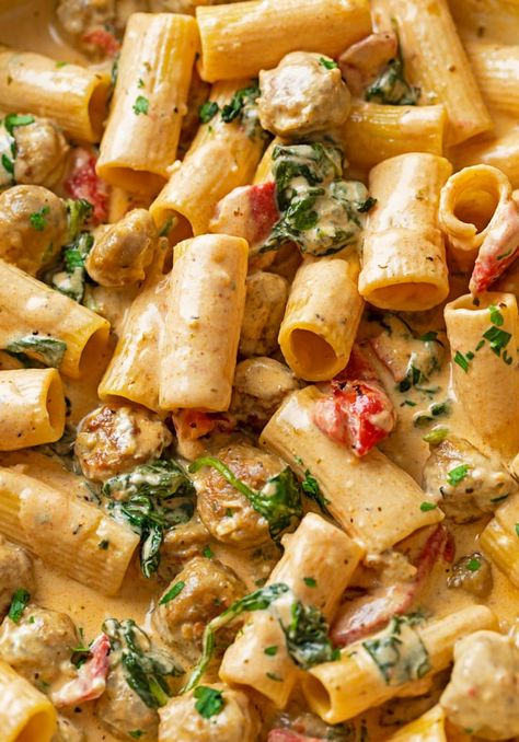 This Creamy Sausage Pasta recipe has a cream cheese and Parmesan blend with roasted red peppers, sweet or spicy Italian sausage, spinach, and your choice of pasta! You will love this easy dinner idea. Creamy Rose Pasta Sauce, Creamy Italian Sausage Pasta, Sweet Italian Sausage Recipes, Sweet Pasta, Italian Sausage Spinach, Sausage And Peppers Pasta, Creamy Sausage Pasta, Sausage Pasta Recipe, Seafood Linguine