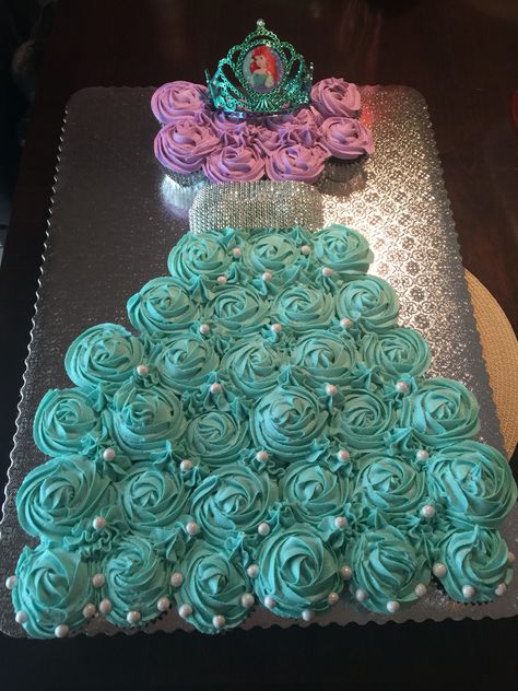 Ariel cupcake dress cake Ariel Cupcake Cake, Ariel Birthday Party Cake, Ariel Cupcakes, Princess Ariel Cake, Cupcake Dress Cake, 1st Birthday Foods, Ariel Cake, Ariel Birthday Party, Ariel Party