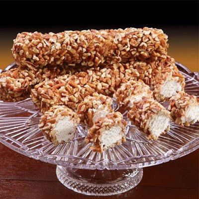 In a large bowl, combine the marshmallow cream, powdered sugar, and vanilla extract. Stir with a stiff spoon until it becomes too difficult, then knead ... Pecan Logs, Pecan Log Roll, Pecan Log, Soft Caramels, Pecan Rolls, Marshmallow Cream, Soft Caramel, Food Log, Fast Easy Meals