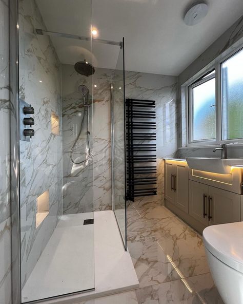 A real luxury feel to this bathroom renovation with1200 x 600 porcelain gold Calcutta tiles, nickle hardware throughout and bespoke lighting making the fitted furniture pop. @mlplumbingandtiling 😍👌🏻 #EasyBathrooms #bathroominspo #interiordesigner #bathroomdecor #remodel #renovation #interiordesign #bathroomgoals #bathroominspiration #home #property #dreamhome #realestate #homedesign #homesweethome #flooring #tiles #bathroomtiles Calcutta Tile Bathroom, Calcutta Tile, Bathroom Goals, Bespoke Lighting, Bathroom Inspo, Simple Bathroom, Fitted Furniture, Bathroom Renovation, Bathroom Inspiration