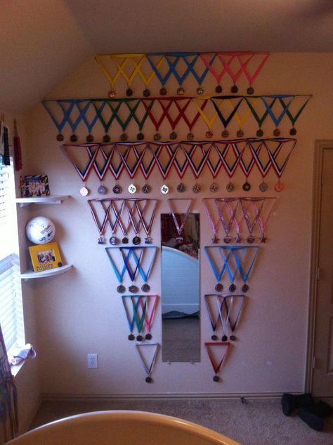 Medal wall from all of my gymnastics medals my dad created for me! Medals Display Ideas, Gymnastics Room Decor, Gymnastics Medal Display, Gymnastics Bedroom, Gymnastics Decor, Hanging Medals, Medals Display, Gymnastics Medals, Gymnastics Wall Art