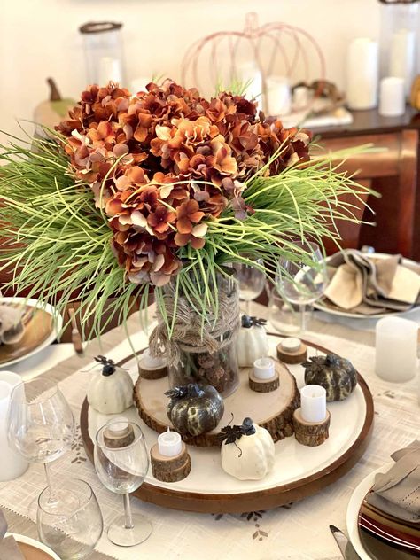 Thanksgiving is a great time to use rustic, earth tone colors on our tablescape. This grey and brown table setting matches perfectly with the burlap table runner, brown Thanksgiving scroll, leaf diy banner, and neutral fall decor throughout the dining room. #earthtones #neutralthanksgiving #rusticfallcenterpiece Brown Table Setting, Brown Tablescape, Lazy Susan Serving Tray, Rustic Fall Centerpieces, Rustic Napkin Rings, Rustic Napkins, Rustic Thanksgiving, Easy Fall Decor, Thanksgiving Tablescape