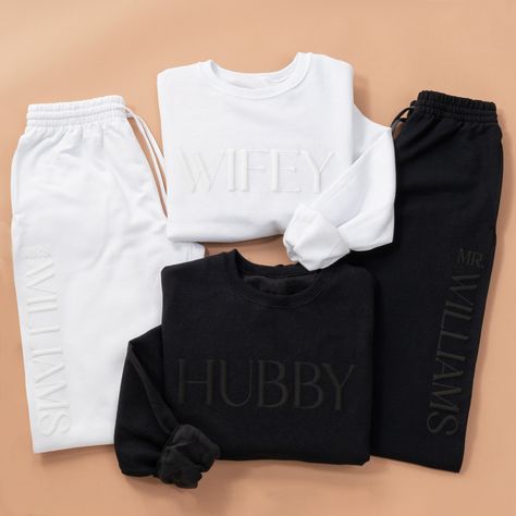 Beautiful Wifey / Hubby Sweatsuits personalized with the last name on the joggers. Additional personalization options are available for the chest, and/or the cuff (see images for options). Order both sets for an amazing Honeymoon Outfit. Perfect Bachelorette Gift, Bridal Shower or Wedding Gift. White Bride Sweat Suit, White Bridal Sweatsuit, Mr And Mrs Outfits, Wedding Gifts For Him From Bride, Wedding Exit Outfit Sweats, Hubby And Wifey Sweatshirts, Sweat Suit Wedding Exit, Bride Sweat Suit Wedding Day, Honeymoon Matching Outfits