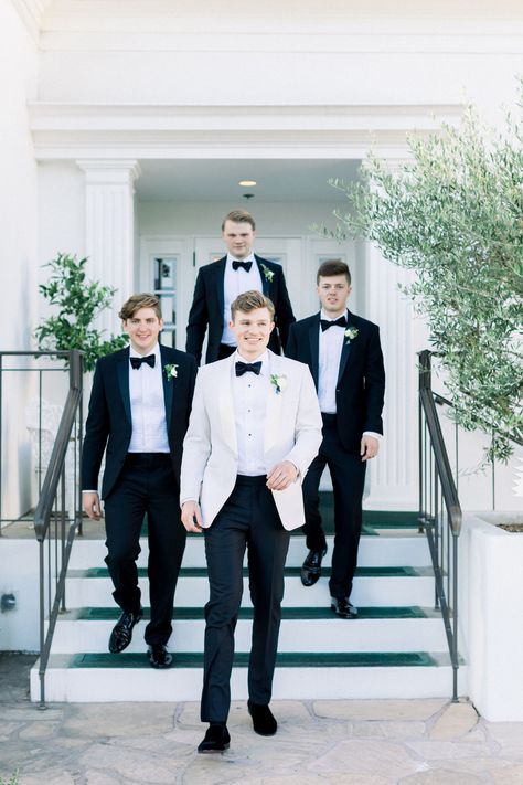 Groomsmen Attire Black, White Tuxedo Wedding, Flower Aisle, Black Tuxedo Wedding, Groom Suit Black, White Tuxedo Jacket, Groom Tuxedo Wedding, Groomsmen Tuxedos, Groom And Groomsmen Suits