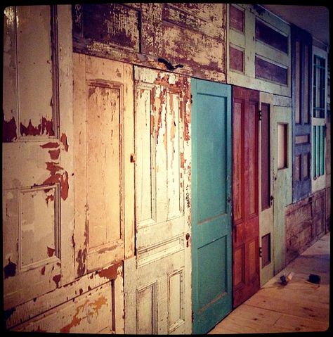 wall of vintage doors. Great on back stairs or long hallow to add a little character Door Walls Old, Old Door Divider Wall, Old Doors Wall, Wall Made Of Doors, Wall Made From Old Doors, Wall Of Old Doors, Old Door Wall, Wall Of Doors, Speakeasy Decor