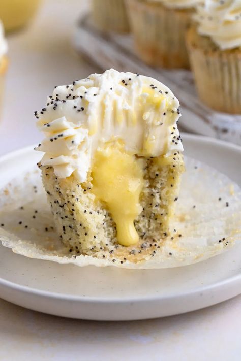 Lemon Poppy Seed Cupcakes with Lemon Curd Filling #lemon #lemoncurd #poppyseed #cupcake #baking #dessert #dessertrecipe | Bakes by Brown Sugar Lemon Poppy Cupcakes, Lemon Filled Cupcakes, Lemon Poppyseed Cupcakes, Poppyseed Cupcakes, Poppy Seed Cupcakes, Lemon Poppy Seed Cupcakes, Lemon Curd Cupcakes, Lemon Cupcake, Dessert Snacks