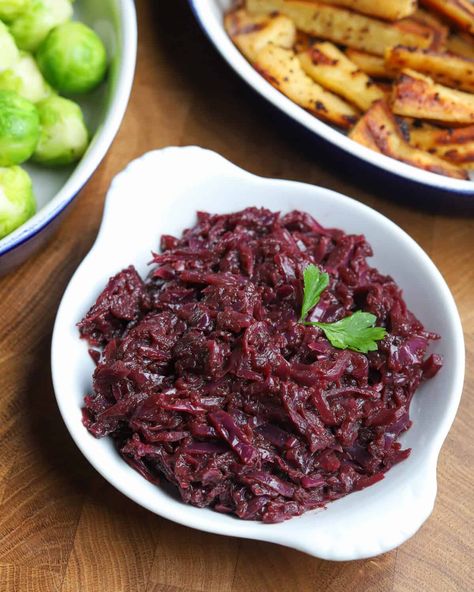 This deeply spiced braised red cabbage with apple and balsamic vinegar is an easy vegan and gluten-free side dish that pairs perfectly with winter comfort food and is a must for Christmas dinner! It can also be made ahead and stored in the fridge or freezer and re-heated on the day for ultimate convenience. #braisedredcabbage #christmasredcabbage #vegansides #veganchristmas #veganredcabbage #glutenfreesides #glutenfreechristmas Layered Potato Bake, Red Cabbage With Apples, Vegetable Pot Pies, Braised Red Cabbage, Layered Potato, Braised Cabbage, Winter Meals, Gluten Free Sides, Dumping Ground