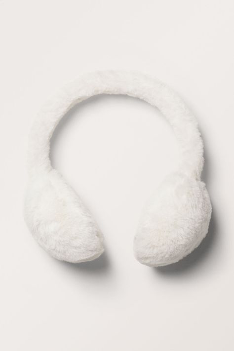 A pair of fuzzy earmuffs crafted from a plush recycled polyester. Fuzzy Headphones, Christmas Wishlist Items, Cute Wishlist, White Earmuffs, Cute Earmuffs, Fuzzy Earmuffs, Xmas List Ideas, Gloves Aesthetic, Gift Wishlist