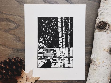 "\"Winter Cabin #3\" is a handprinted linocut print. This piece of art is printed on 8inx10in eco-friendly paper that's made right in Michigan! Because each piece is printed by hand, each one will be slightly unique! This is the beauty of buying a hand-printed piece of art. Check out my Instagram @blackrivergoods to dive deeper into the process! * The Printmaking Process * Each block print starts with a blank piece of lino or rubber block. I then sketch out my design, refine it, and then transfer that design to the block. Carving tools are then used to carefully carve out the design from the block. Once I am happy with the look, ink is then rolled onto the block and a piece of paper is pressed and rubbed into the ink. It's a time-consuming process, but it's all worth it when that paper is Snowy Cabin, Snowy Woods, Cabin Art, Linocut Art, Winter Cabin, Eco Friendly Paper, Carving Tools, Lino Print, Linocut Prints