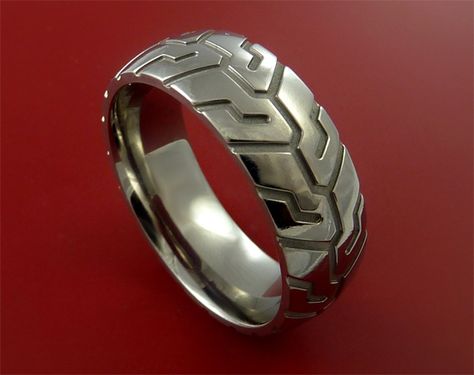 Should get this for my husband. Tire Tread Ring Biker Bride, Tire Tread Ring, Motorcycle Wedding, Biker Wedding, Tire Tread, Unique Bands, Biker Rings, Titanium Ring, Carved Designs