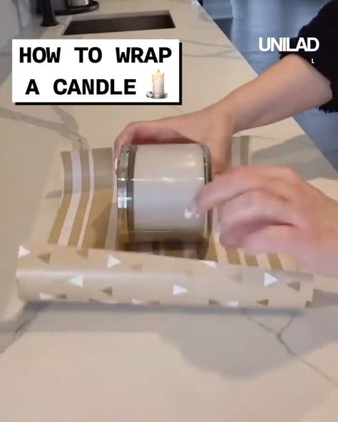 How to wrap a candle | candle | Finally! A way to wrap a candle without it looking like Christmas cracker 😂 | By GOODLAD Wrap A Candle For Christmas, Candles Wrapping Ideas, How To Wrap Candles For Christmas, Gift Wrapping A Candle, How To Wrap A Jar With Wrapping Paper, How To Wrap A Candle For Christmas Gift, Wrapping Candles For Christmas Gifts, How To Wrap Candles Gift Packaging Ideas, Wrapping A Candle Gift