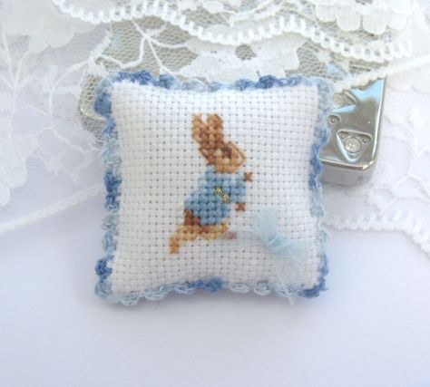 dollhouse pillow cushion peter rabbit beatrix by Rainbowminiatures Minature Things, Miniature Needlepoint, Tiny Stuff, Peter Rabbit And Friends, Rabbit Pillow, Miniature Embroidery, Crochet Needlework, Cross Stitch Pillow, Mini Cross Stitch