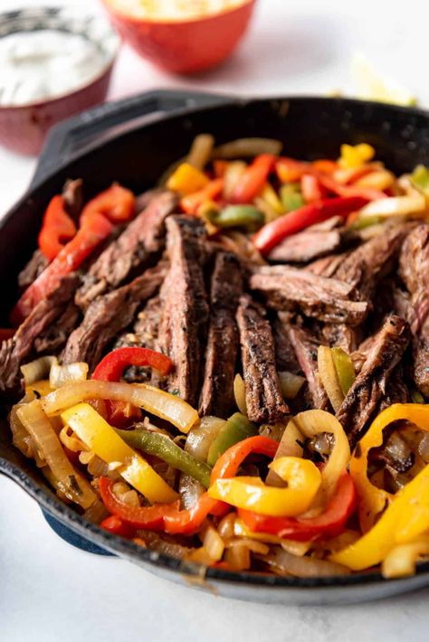 Steak Fajitas are made with juicy strips of marinated skirt steak and tender veggies served with soft flour tortillas and fixings like sour cream, a Mexican cheese blend, pico de gallo, and guacamole. They are always a hit! #steak #fajitas #Mexican #best #dinner #marinade #easy #homemade #seasoning #cincodemayo #skirtsteak Best Steak Fajitas, Steak Fajita Marinade, Mexican Steak, Easy Steak Fajitas, Skillet Steak, Steak Fajita Recipe, Fajita Marinade, Leftover Steak, Fajitas Recipe