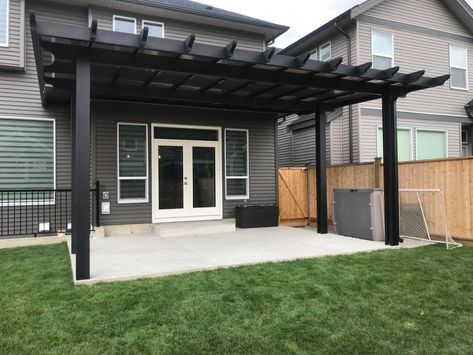 Black Patio Cover, Black Patio Covers Attached To House, Black Pergola Attached To House, Black Covered Patio, Pergola Against House, Black And Wood Pergola, Black Metal Pergola Ideas, Black Pergola Ideas, Outdoor Pergola Attached To House