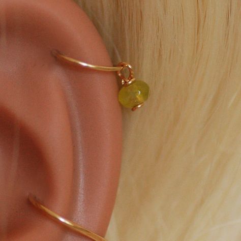 HELIX PIERCING JEWELRY gold helix piercing green hoop helix piercing small helix piercing jewelry Helix Hoop Earring With Charm, Lower Helix Piercing Hoop, Ear Arrangement, Hoop Helix Piercing, Gold Helix Piercing, Piercings Nose, Helix Jewelry, Helix Piercing Jewelry, Helix Ear