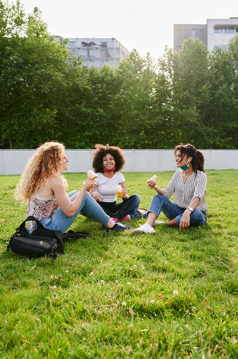 Three diverse young female friends with protective face masks around their necks talking during a picnic together in a city park People In Park Photography, Three People Sitting Together, Friend Dynamic, People In Park, Stock Photography Ideas, Friends Talking, Park Photoshoot, Architecture Design Presentation, Talk With Friends