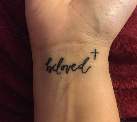 Beloved with a cross  tattoo   Remember how much you are loved Loved Tattoo Word, Cross And Quote Tattoos, Be Still Wrist Tattoos For Women, Beloved Tattoo With Cross, Semi-colon Tattoo Bible Verse, Cross With Scripture Tattoo, Wrist Tattoos Quotes, Beloved Tattoo, Believe Wrist Tattoo