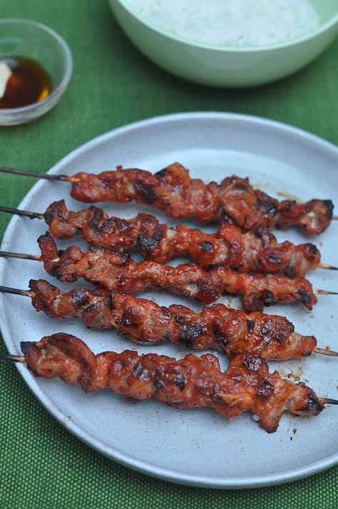 Filipino style pork skewers...i remember, as a kid, the neighbors coming by and asking what that delicious smell was coming from the backyard. it wasn't your typical "cooking out on the grill" smell.