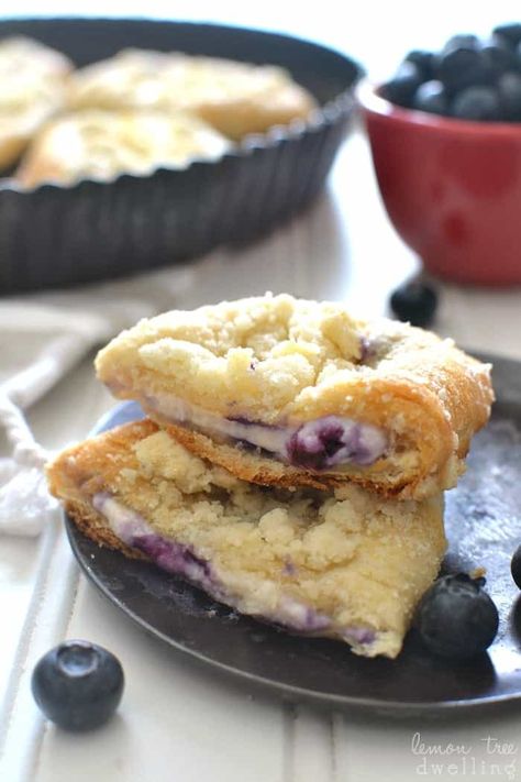 These Blueberry Cheesecake Crescent Rolls are stuffed with a sweet cheesecake filling and bursting with fresh blueberries. Add a buttery streusel topping for an extra special breakfast treat! Blueberry Cream Cheese Croissant Bake, Mini Blueberry Cheesecake Crescent Rolls, Blueberry Cheesecake Crescent Roll Recipes, Blueberry Crescent Bake, Blueberry Pillsbury Crescent Rolls, Blueberry Cream Cheese Breakfast Bake, Berry Crescent Rolls, Blueberry Breakfast Rolls, Crescent Roll Breakfast Recipes Blueberries