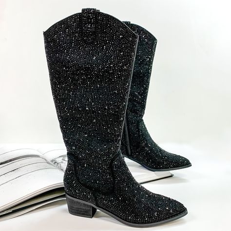 Pictured are black cowboy boots with black crystals covering the entire boot. These boots also include a black heel and sole. These boots are pictured on front on a white background with one boot resting on an open book. Rhinestone Cowboy Boots, Rhinestone Cowboy, Giddy Up Glamour, Black Boots Tall, Tall Boot, Pull On Boots, Black Rhinestone, Black 7, Tall Boots