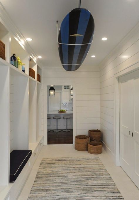 Perfect use of shiplap. The surf board adds such a fun touch. White Beach Houses, Cottage Laundry Room, White Beach House, Built In Lockers, House Of Turquoise, Coastal Living Rooms, Beach House Interior, Beach House Design, Beach Cottage Style