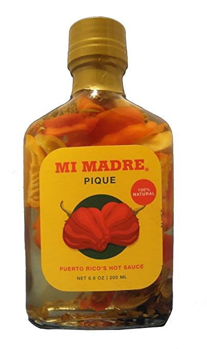 The Puerto Rican Pantry Staple That Chef Juan José Cuevas Uses on Everything | Pique, a condiment made of fermented pineapple juice and a mix of chilis, adds flavor to just about anything—make it yourself or order it online. Pique Recipe, Puerto Rican Hot Sauce, Fermented Pineapple, Cheesesteak Stuffed Peppers, Puerto Rican Dishes, Traditional Chili, Hot Sauce Recipes, Rum Bottle, Puerto Rican Recipes