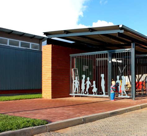 Pre-Primary School, University of the Free State, Bloemfontein, South Africa. Main entrance with steel cut-outs of children. Sm!t Architects Primary School Entrance Design, School Compound Wall Design, School Elevation, Bloemfontein South Africa, Pre Primary School, Compound Wall Design, Pre Primary, School Entrance, Compound Wall