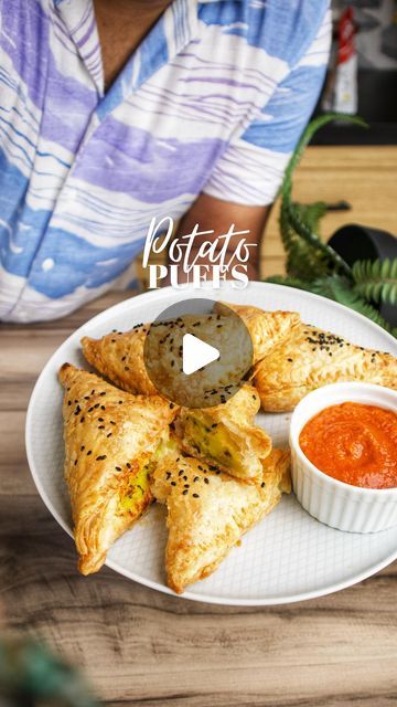 Nehal karkera on Instagram: "Chicken puff or Veg Puff ???
Fight in the comments 🤺🥷

Ingredients 
For the potato filling 
2 tbsp oil
1 tsp mustard seeds
1 tsp cumin seeds
1 tbsp chopped ginger
1 tbsp chopped garlic
2 chopped green chillies
Pinch of hing
1/2 tsp turmeric 
Salt to taste
3-4 boiled potatoes 
1 tbsp chopped coriander 
Other ingredients 
5 sheets puff pastry
Melted butter 
Black sesame seeds
Method
1. Thaw out the puff pastry shee and keep aside.
2. Now for the filling, boil the potatoes and gently mash them up.
3. Next heat oil in a kadai and fry the cumin, mustard, ginger, garlic and chillies for 1 mins, then add the hing and turmeric and cook for a few seconds, next add the potatoes and mix well, season with salt and finish with some chopped coriander 
4. Now place the puff Veg Puff, Chicken Puff, Chicken Puffs, Potato Filling, Black Sesame Seeds, Cumin Seeds, Mustard Seeds, Black Sesame, Boiled Potatoes