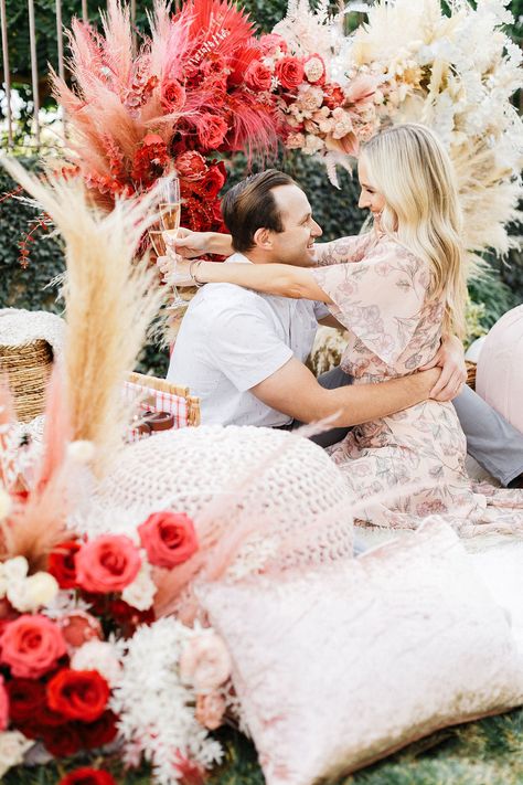 Roses are red…blush is the perfect hue…we love this look, how about you? For this lovely couple we curated a boho chic styled picnic with blankets, throws, and the most decadent floral shaped heart covered in red, blush, and cream toned roses and flowers. Boho Valentines Day Photography, Valentines Day Picnic, Styled Picnic, Valentine Picnic, Boho Valentines Day, Valentines Day Photography, Merci Chocolate, Picnic Shoot, Boho Valentines