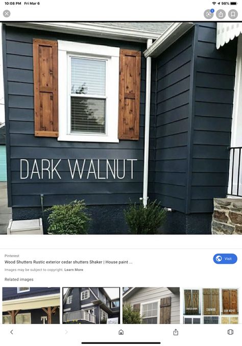 Gray Siding With Wood Shutters, Dark Grey House Wood Shutters, Navy House Black Shutters, Black House Wooden Shutters, Blue And Grey House Exterior, Black House Wood Shutters, Black House With Wood Shutters, Midnight Blue House Exterior, Dark Blue Exterior House Colors