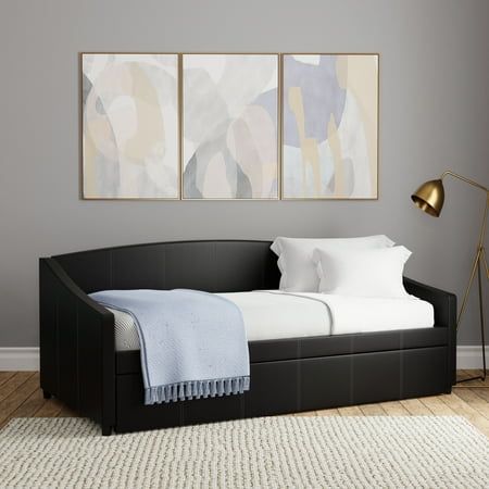 Even the spaces where you find your calm need a little touch of style. With this Hillsdale Modern Indoor Daybed, find a design energy that gives your interiors a bit of edge. Fully upholstered in black faux leather, the double-stitched curved back and flare-style side rails make this piece something worth relaxing onand talking about. Solidly constructed from sturdy wood, this adult daybed also features a trundle front that gives you an extra place for overnight guests, or a comfortable spot for pets to relax with you. Twin mattress required, not included. Assembly required. Adult Daybed, Black Day Bed, Daybed With Pop Up Trundle, Indoor Daybed, Black Daybed, Metal Daybed With Trundle, Twin Daybed With Trundle, Snug Room, Modern Daybed