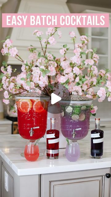 Brittany | Home Decor & Style on Instagram: "Batch cocktails using @Empress1908Gin Indigo and Elderflower Rose Gin |AD| These drinks are perfect for wedding celebrations, bridal showers, and summer parties! See full cocktail recipes below! #EmpressGin #EmpressIDO #SipResponsibly

INGREDIENTS:

Purple Mojito Lime Drink 💜 (Serves 12 people)
-3 cups Empress Indigo Gin 
-3 liter Limeade
-1 liter Soda Water
-Sliced Limes + Lime Juice/Limeade to freeze in cubes
-Mint to taste + Garnish

Pink Grapefruit Drink 💗 (Serves 12 people)
-3 cups Empress Elderflower Rose Gin
-3 liter Grapefruit Juice
-1 liter Soda Water
-Sliced Grapefruit + Grapefruit juice to freeze in cubes
-Rosemary to Garnish

TIP: Add the Soda Water/ Sparkling Water last and not too far in advance before serving to avoid flat drink Purple Mojito, Sliced Grapefruit, Alcohol Soaked Fruit, Elderflower Liquor, Bachelorette Food, Empress Gin, Grapefruit Drink, Water Sparkling, Summer Punch