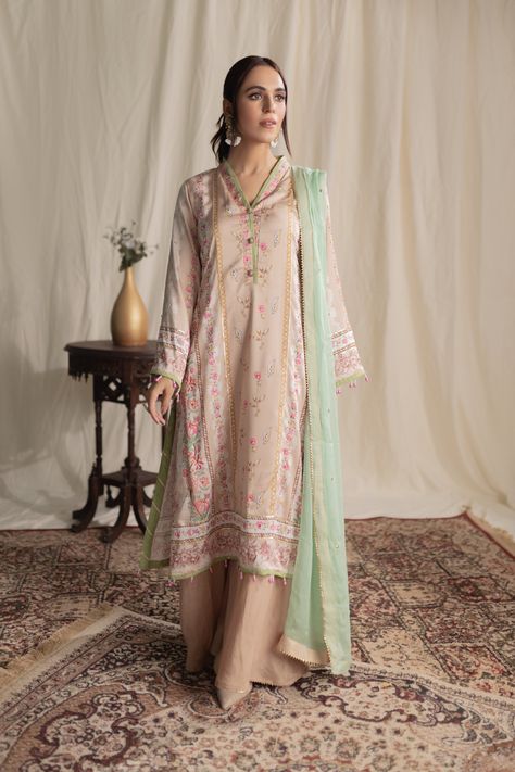 With a mint green dupatta adding a pop of color, the shirt, finished with contrasting edges and pearls tassels, complements the ijar trouser detailed with gota lace. Elevate your style with this chic ensemble that seamlessly blends tradition with contemporary flair. Be it a festive party or a wedding night, these luxury silk dresses are perfect choice for any event. Shirt Fabric: Luxury Silk Pant Fabric: Pure Raw Silk (PK) Work Technique: Digital Printed detailed with Handwork Embellishments Green Dupatta, Silk Pant, Trousers Details, Silk Dresses, Silk Trousers, Coral Peach, Luxury Silk, Silk Pants, Wedding Night