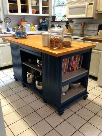 after spending countless hours surfing the web for the perfect kitchen island with a very small budget, left me with very little to choose from.  So I decided to make my own and off I went to hit all the second hand stores.   SCORE!! Found an old solid wood desk and also butcher block table top. Purchased both for $70. Removed the top of the desk and moved it to the bottom for a platform for the island, attached the butcher block top and added bun feet to bring the island to counter he… Dresser Remakes, Faux Brick Backsplash, Review Notes, Butcher Block Table, Faux Brick Panels, Old Cabinet Doors, Rustic Kitchen Island, Stock Cabinets, Space Kitchen