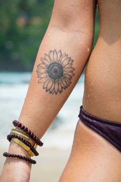 Back Of Neck Sunflower Tattoo, Tattoo Sunflower Arm, Sun Son Tattoo, Sunflower Tattoo Forearm Simple, Sunflower Tattoo Inner Arm, Sunflower Tattoo Bicep, Fine Line Sunflower Tattoo Forearm, Elbow Sunflower Tattoo, Sunflower Tattoo Back Of Arm