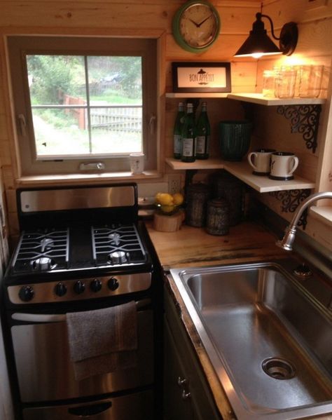 Full Kitchen with Corner Shelves and More in this THOW Corner Stove, Best Tiny House, Tiny House Kitchen, Cabin Kitchens, Kitchen Corner, House Design Kitchen, Tiny House Cabin, Tiny House Living, Tiny Kitchen