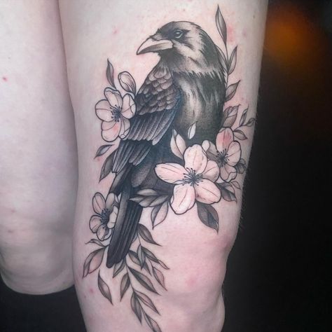 Rose And Crow Tattoo, Raven Tattoo Flowers, Flower Raven Tattoo, Tattoo Ideas Female Black And Grey, Raven And Cherry Blossom Tattoo, Crow Tattoo With Flowers, Floral Raven Tattoo, Raven Hip Tattoo, Crow And Flowers Tattoo