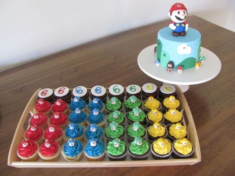 Super Mario cake and matching cupcakes Simple Mario Cupcakes, Mario Cake And Cupcakes, Mario Cupcakes, Super Mario Cupcakes, Groom Cakes, Mario Bros Cake, Cupcakes Fondant, Super Mario Cake, Mario Cake