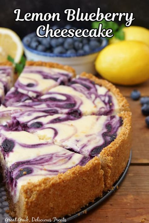 Lemon Blueberry Cheesecake is a rich and creamy, delicious lemon cheesecake recipe with a homemade blueberry filling swirled inside and on top, then baked to perfection. Blueberry Lemon Cheesecake Recipes, Blueberry Lemon Cheesecake, Mini Lemon Cheesecakes, Blueberry Cheesecake Recipe, Food Sides, Lemon And Blueberry, Dessert Cheesecake, Lemon Blueberry Cheesecake, Lemon Cheesecake Recipes