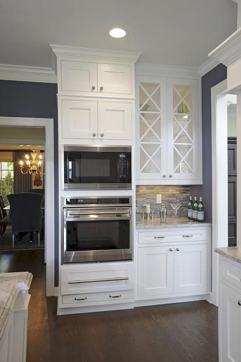 White glass doors above wet bar with crystal, bar glasses, etc. Wall Oven Kitchen, Trendy Kitchen, Kitchen Redo, Kitchen Remodel Idea, Wall Oven, White Cabinets, Beautiful Kitchens, Küchen Design, The Room