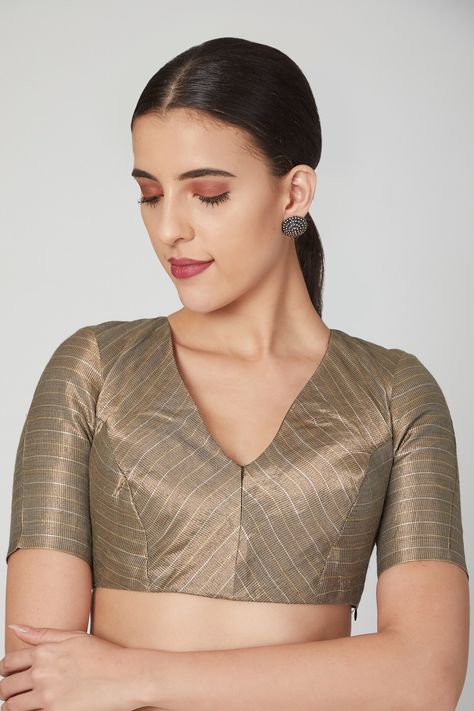 Featuring a gold blouse in brocade base with silver and copper stripes. It has v-neckline. This contains only one piece.  FIT: Fitted at bust. COMPOSITION: Brocade. CARE: Dry clean only. Brocade Blouse Designs, Blouse Designs High Neck, Silver Blouse, Blouse Indian, Brocade Blouse, Brocade Blouses, Hand Work Blouse, Blouse Designs Silk, Gold Blouse