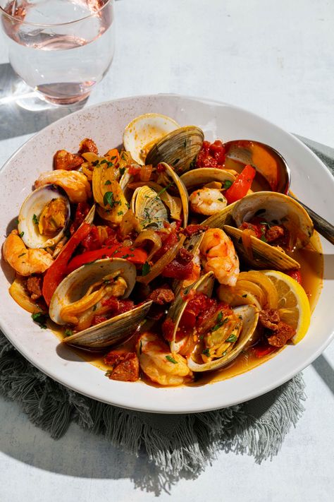 Our cataplana captures abundant fresh seafood, smoky cured meat, and vibrant paprika in a rich, ruddy broth. Seafood Cataplana, Stew For Two, Portuguese Seafood, Cooks Illustrated Recipes, Cooks Country, Fish Monger, Funky Fish, Illustrated Recipe, Portuguese Food