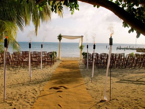 Multiple tiki torches along aisle leading to the chairs/altar. Tiki Torches, Wedding Inspo, Beach Wedding, Our Wedding, Water