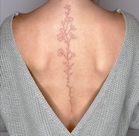 Spine Tattoos For Women Placement, Cherry Blossoms Spine Tattoo, Spine Cherry Blossom Tattoos, Delicate Floral Spine Tattoo, Fine Like Spine Tattoo, Simple Floral Back Tattoo, Spine Tattoos Cherry Blossoms, Minimalist Back Tattoo Women Spine, Spine Tattoo Cherry Blossom