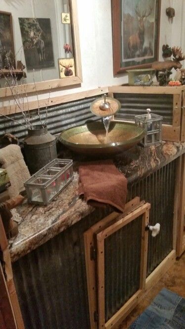 My dad remodeled his hallway bathroom to go with their rustic theme through out the house. Cabinet Towels, Cobblestone Houses, Forest Bathroom, Rustic Bathroom Sinks, Taxidermy Shop, Cabin Rooms, Barn Bathroom, Texas Quilt, Antique Bathroom