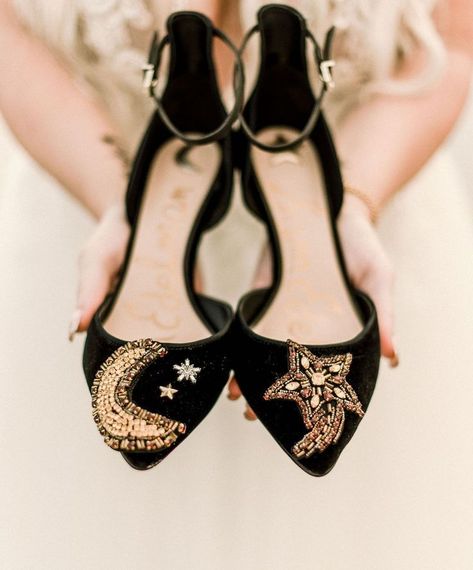 Wedding accessories | Moon and stars embroidered on black and gold wedding shoes for a celestial inspired beach wedding | Celestial Wedding Inspiration with Incredible Star and Moon Details | #equalitymindedweddings #lgbtweddingmagazine #loveinc #celestialwedding #blackweddingshoes #moonandstars #floridaweddings #blackweddingdetails Wedding Celestial, Strappy Wedding Shoes, Celestial Wedding Theme, Black Wedding Shoes, Black And Gold Wedding, Gold Wedding Shoes, Starry Night Wedding, Fun Wedding Shoes, Celestial Wedding