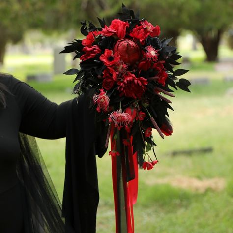 This Large Statement cascading bridal bouquet is made up of Black Roses Deep Red Roses, Black Italian Ruscus Leaves and various other flowers including Black Anthurium, Mums, etc. . This hand tied bouquet is ready for your amazing Dark + Moody, Contemporary or Goth wedding. It's our newest addition to our floral collection. . http://Bouquets.Wedding for more styles and selections of pre-made bouquets and boutonnieres. We take orders for custom creations! or http://GothicWeddingBouquets.com ... Red And Black Cascading Bouquet, Red Cascade Bridal Bouquet, Red And Black Wedding Bouquets, Diy Gothic Wedding, Cadaver Collector, Black And Red Bouquet, Wedding Flowers Dark, Black Anthurium, Witchy Flowers