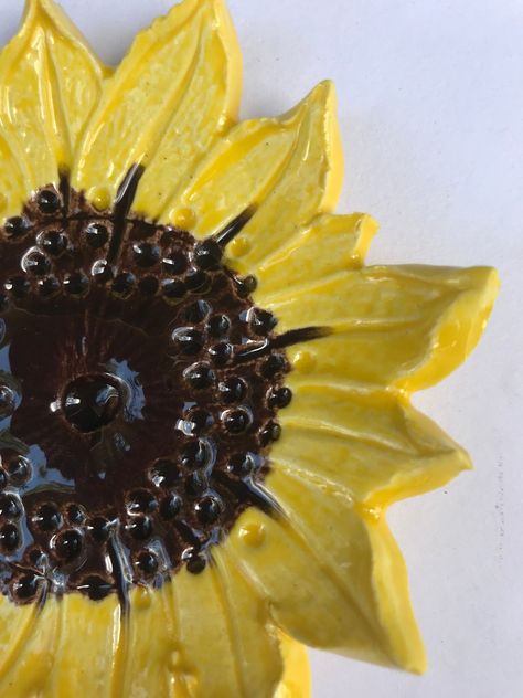 Handcrafted pottery sunflower dish makes a great spoon 🥄 rest or little soap dish, or dish to hold your rings, etc. it is approximately 4” in diameter and is available as a sunflower, Daisy or coneflower. It is dishwasher, microwave, oven safe with lead free glaze. Pottery Sunflower, Pottery Decor, Sunflower Theme, Sunflower Daisy, Handcrafted Pottery, Place Holder, Handcrafted Decor, Tea Bag Holder, Hand Built Pottery